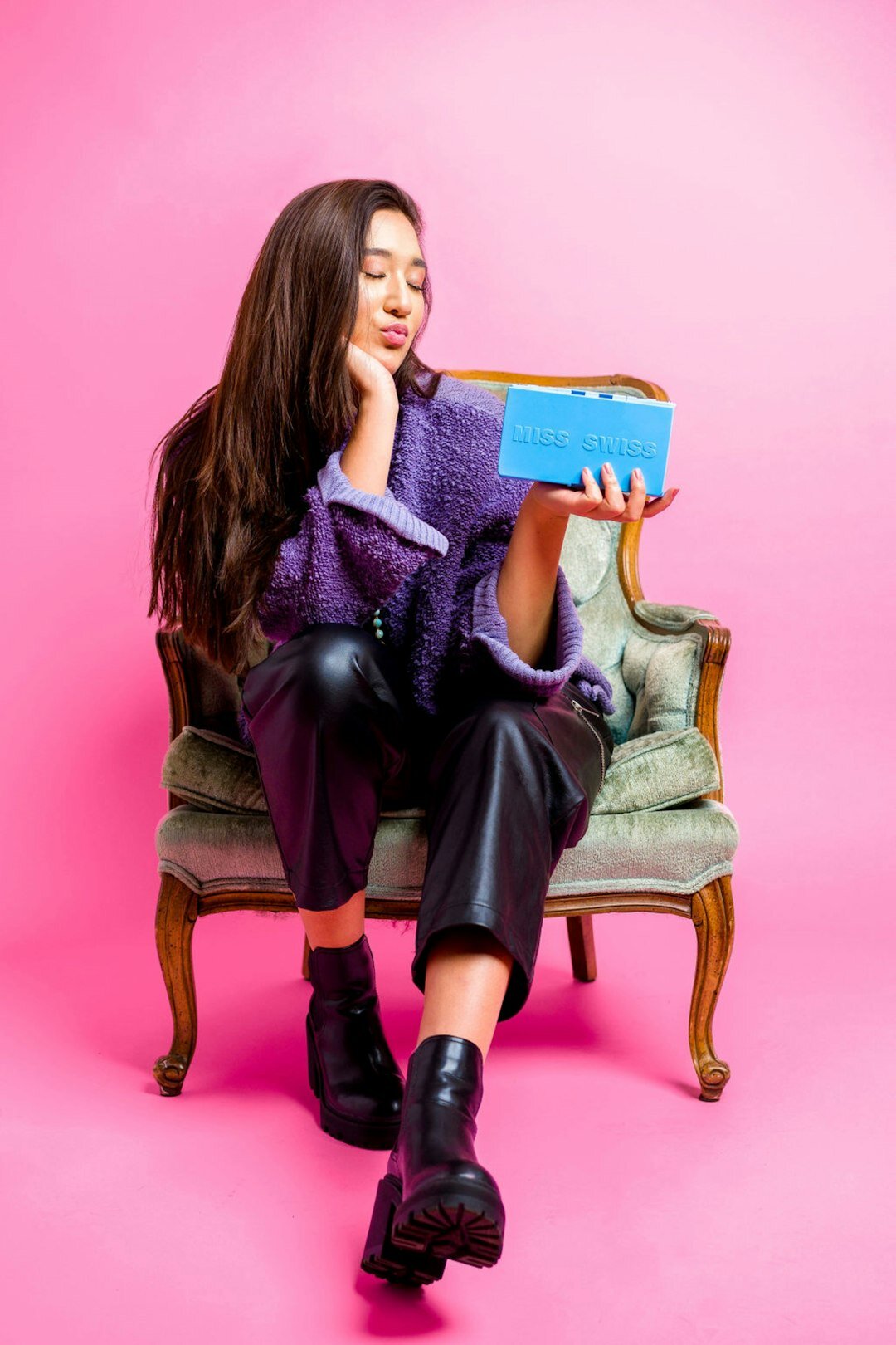 Studio portrait of a Swiss-European female journalist with notebook