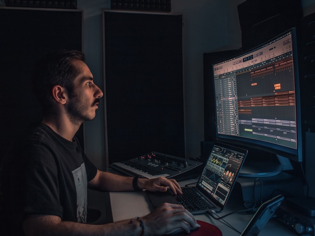 man recording music in studio