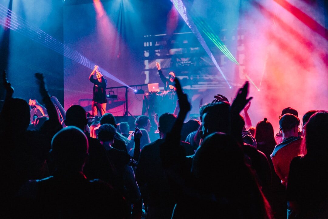 Concert stage with colorful lights and crowd
