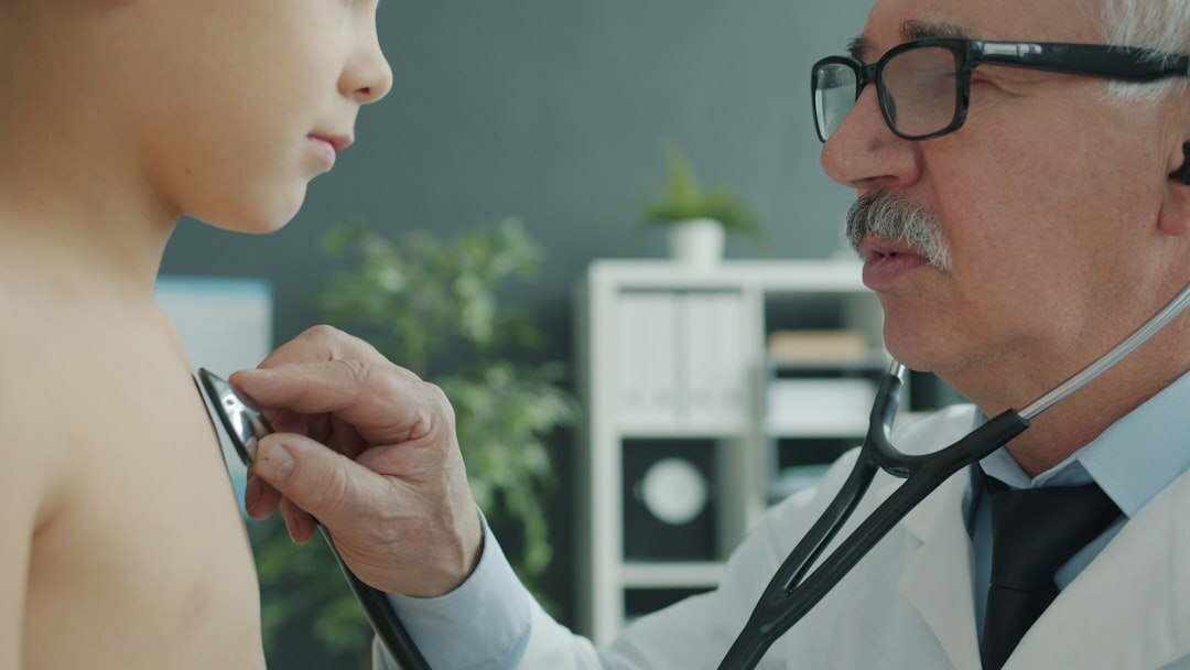 doctor examining patient in clinic