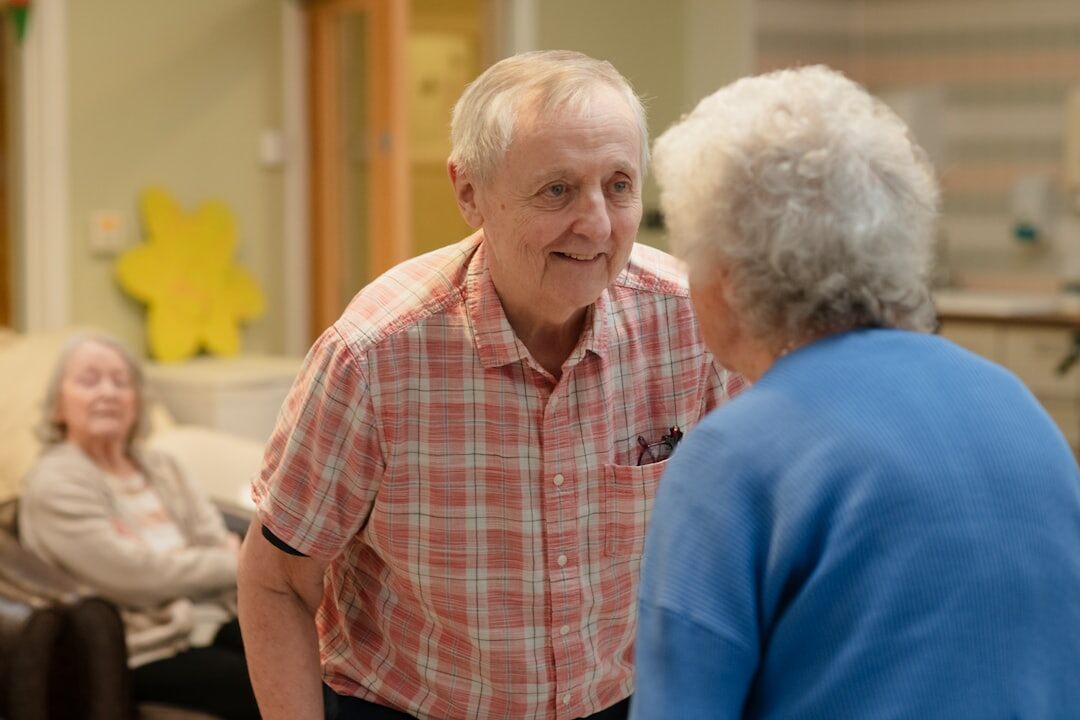 elderly patient smiling with doctor